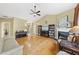 Open living room boasts vaulted ceilings, fireplace, and hardwood floors at 30 Cornerstone Dr, Franklinton, NC 27525
