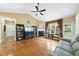 Inviting living room with a fireplace, ceiling fan, and large window, perfect for relaxation at 30 Cornerstone Dr, Franklinton, NC 27525
