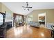 Cozy living room featuring hardwood floors, a fireplace, and access to the adjacent kitchen at 30 Cornerstone Dr, Franklinton, NC 27525