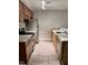 Kitchen featuring updated cabinets, stainless steel appliances, granite countertops, and new floors at 3047 Huntleigh Dr, Raleigh, NC 27604