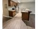 Kitchen featuring updated cabinets, stainless steel appliances, granite countertops, and new floors at 3047 Huntleigh Dr, Raleigh, NC 27604