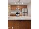 Kitchen featuring updated cabinets, stainless steel appliances, granite countertops, and new floors at 3047 Huntleigh Dr, Raleigh, NC 27604