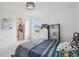 Bedroom featuring bed, window with natural light and closet space, complete with playful decor at 316 Wellwater Ave, Durham, NC 27703
