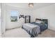 bedroom with a comfortable bed, a window view, and video game themed decor and colors at 316 Wellwater Ave, Durham, NC 27703