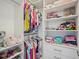 Organized walk-in closet with shelving and hanging space for clothes and accessories at 316 Wellwater Ave, Durham, NC 27703