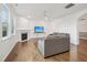 Inviting living room with a fireplace, ceiling fan, hardwood floors, and ample natural light at 316 Wellwater Ave, Durham, NC 27703