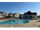 Community pool with clubhouse and lounge area for relaxing and socializing with neighbors at 316 Wellwater Ave, Durham, NC 27703