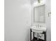 Simple and modern powder room with stylish vessel sink, mirror, and minimalist design at 316 Wellwater Ave, Durham, NC 27703