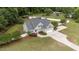 Aerial view of home with a large lawn, driveway, and a privacy fence at 3216 Nc Hwy 42, Willow Springs, NC 27592