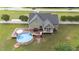 A delightful backyard featuring a pool, deck, screened porch, and meticulously maintained greenery at 3216 Nc Hwy 42, Willow Springs, NC 27592