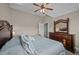 Large bedroom featuring a dresser with a mirror, carpeted floors, and a ceiling fan at 3216 Nc Hwy 42, Willow Springs, NC 27592