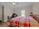 Bedroom featuring wood-look floors, natural light, with a gaming setup at 3216 Nc Hwy 42, Willow Springs, NC 27592