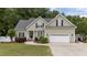 Charming single-Gathering home with a well-manicured lawn, two-car garage, and inviting curb appeal at 3216 Nc Hwy 42, Willow Springs, NC 27592