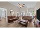 Open-concept living room with high ceilings, hardwood floors, and arched doorway at 3216 Nc Hwy 42, Willow Springs, NC 27592