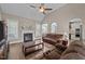 Inviting living room featuring a fireplace, hardwood floors, neutral walls, and cozy furnishings at 3216 Nc Hwy 42, Willow Springs, NC 27592
