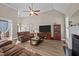 Comfortable living room with neutral walls, vaulted ceiling, hardwood floors, and cozy furnishings at 3216 Nc Hwy 42, Willow Springs, NC 27592