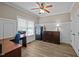 Well-lit home office with wood-look floors, crown molding, and built-in shelving at 3216 Nc Hwy 42, Willow Springs, NC 27592