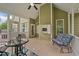 Covered porch with tile flooring features a ceiling fan and screened in windows at 3216 Nc Hwy 42, Willow Springs, NC 27592