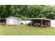Storage shed and carport in the fenced backyard has room for equipment at 3216 Nc Hwy 42, Willow Springs, NC 27592