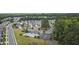 Aerial view of a neighborhood with pool and tennis courts surrounded by trees at 3309 Turner Ridge Dr, New Hill, NC 27562