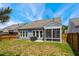 Backyard featuring some grass, patio with grill and screened in porch at 3309 Turner Ridge Dr, New Hill, NC 27562