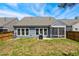 Backyard featuring some grass, patio with grill and screened in porch at 3309 Turner Ridge Dr, New Hill, NC 27562