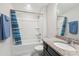 Bright bathroom featuring a shower-tub combo with striped curtain and granite vanity at 3309 Turner Ridge Dr, New Hill, NC 27562