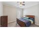 Bedroom with ceiling fan, dresser, and neutral walls providing a cozy, comfortable space at 3309 Turner Ridge Dr, New Hill, NC 27562