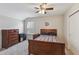 Bedroom with ceiling fan, dresser, and neutral walls providing a cozy, comfortable space at 3309 Turner Ridge Dr, New Hill, NC 27562