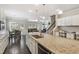 Spacious kitchen features granite countertops, a large island, and seamless transition into the living area at 3309 Turner Ridge Dr, New Hill, NC 27562