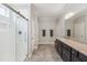 Spacious main bathroom featuring a walk-in shower with glass door and a double sink vanity at 3309 Turner Ridge Dr, New Hill, NC 27562