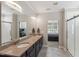 Open bathroom features double sink vanity and walk-in shower at 3309 Turner Ridge Dr, New Hill, NC 27562