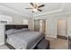 Spacious main bedroom with a tray ceiling, natural light, and carpeted floors at 3309 Turner Ridge Dr, New Hill, NC 27562