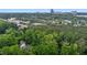 Aerial shot displaying homes nestled among lush trees, offering a serene and private setting within a city at 3323 Cheswick Dr, Raleigh, NC 27609