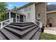 View of the spacious deck with white railings and the screened-in porch at 3323 Cheswick Dr, Raleigh, NC 27609