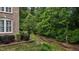 Well-manicured landscaping with a creek that flows through the backyard at 3323 Cheswick Dr, Raleigh, NC 27609