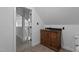 Half bathroom with matching wood vanity and wood look floors at 3323 Cheswick Dr, Raleigh, NC 27609