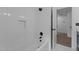 Clean white tiled bathroom with a tub and shower combination and modern fixtures at 3323 Cheswick Dr, Raleigh, NC 27609