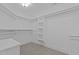 Spacious walk-in closet with ample shelving and storage, carpeted floor at 3323 Cheswick Dr, Raleigh, NC 27609