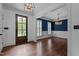 Sophisticated dining area with hardwood floors, detailed trim and a stylish light fixture at 3323 Cheswick Dr, Raleigh, NC 27609