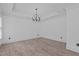 Dining room with hardwood style floors, neutral walls, modern lighting, and lots of light at 3323 Cheswick Dr, Raleigh, NC 27609