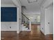 Elegant entryway showcasing hardwood floors, wainscoting, and a view into the dining area at 3323 Cheswick Dr, Raleigh, NC 27609