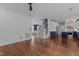 Spacious living area with stairs, a modern kitchen, and hardwood flooring throughout at 3323 Cheswick Dr, Raleigh, NC 27609