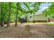 Backyard featuring trees, deck and a fenced perimeter at 3401 Sitzman Ct, Raleigh, NC 27616