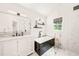 Modern bathroom features marble countertops, glass shower, and soaking tub at 3401 Sitzman Ct, Raleigh, NC 27616