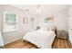 Cozy bedroom features natural light, ceiling fan, and neutral decor creating a warm and inviting space at 3401 Sitzman Ct, Raleigh, NC 27616
