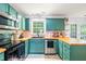 Modern kitchen with custom cabinets, updated appliances, and butcher block countertops at 3401 Sitzman Ct, Raleigh, NC 27616