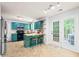 Stylish kitchen featuring updated cabinets, a center island, and modern appliances at 3401 Sitzman Ct, Raleigh, NC 27616