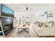 Cozy living room with a fireplace and plenty of natural light at 3401 Sitzman Ct, Raleigh, NC 27616
