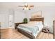 Spacious main bedroom features vaulted ceilings, wood grain dresser, and bench seat at 3401 Sitzman Ct, Raleigh, NC 27616